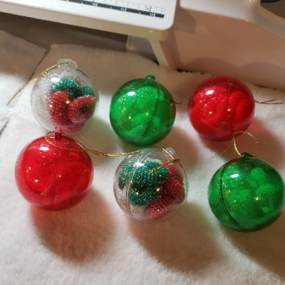 5  Plastic ornaments with little hair ties in it
